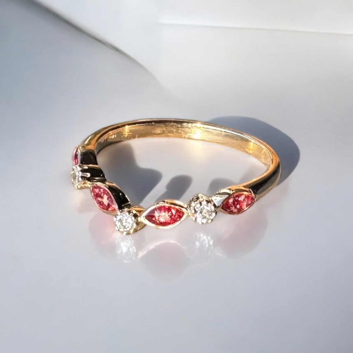 Side view of a 9ct Yellow Gold wishbone, eternity ring with cremation ashes