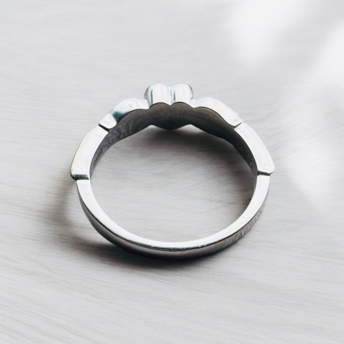 Sterling silver angel wings memorial keepsake ring, personalised with cremation ashes, breastmilk, umbilical cord, hair or pet fur. A meaningful design symbolising love, remembrance and protection. Handcrafted in West Wales by Afallon DNA Jewellery.