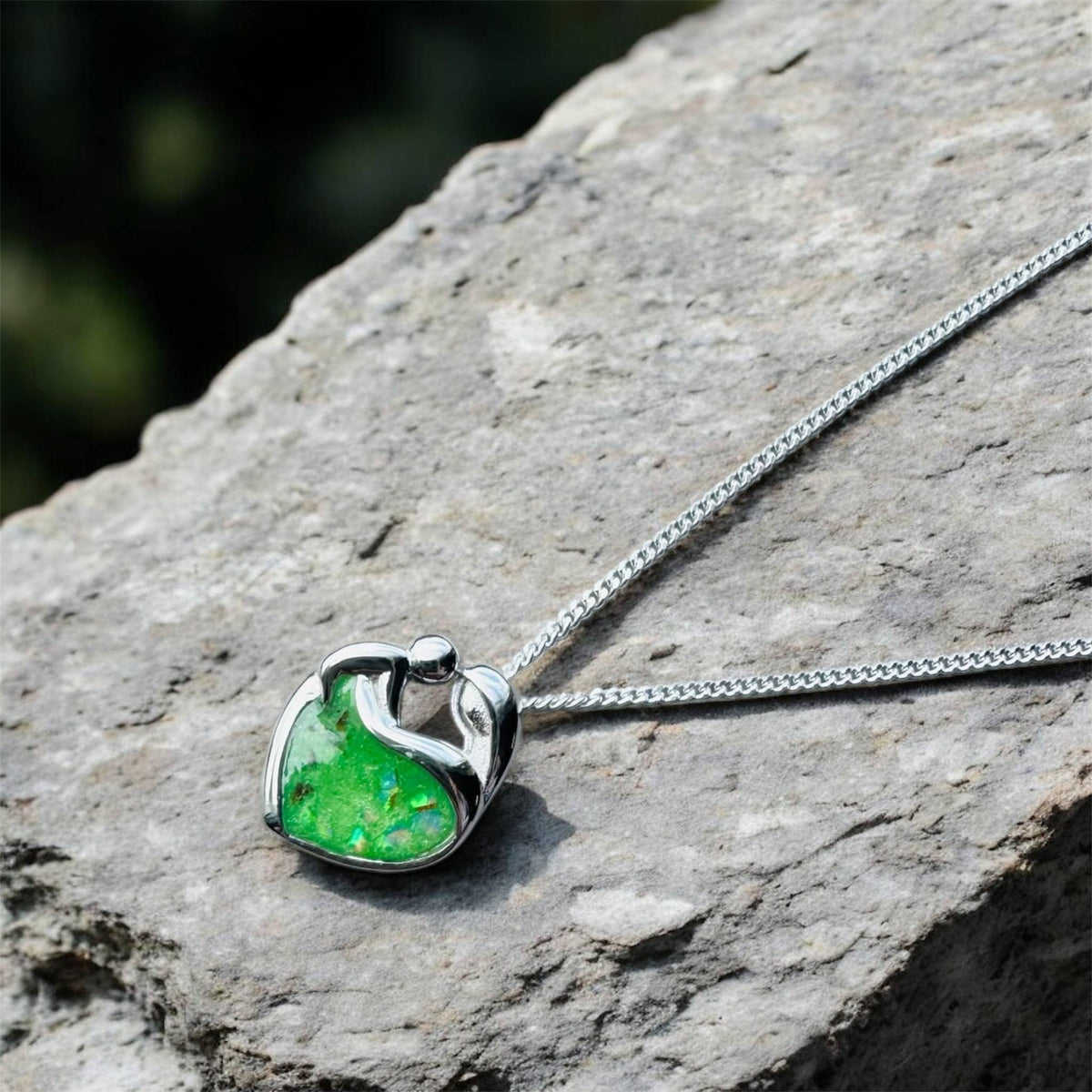 Sterling silver Mother's Love keepsake necklace, personalised with breastmilk, umbilical cord, cremation ashes, hair or pet fur. A beautiful sentimental pendant celebrating the bond between mother and child. Handcrafted in West Wales by Afallon DNA Jewellery.