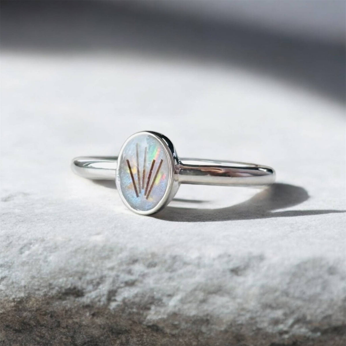 Elegant sterling silver oval keepsake ring, personalised with breastmilk, cremation ashes, umbilical cord, hair or pet fur. A timeless, minimalist design handcrafted in West Wales by Afallon DNA Jewellery.