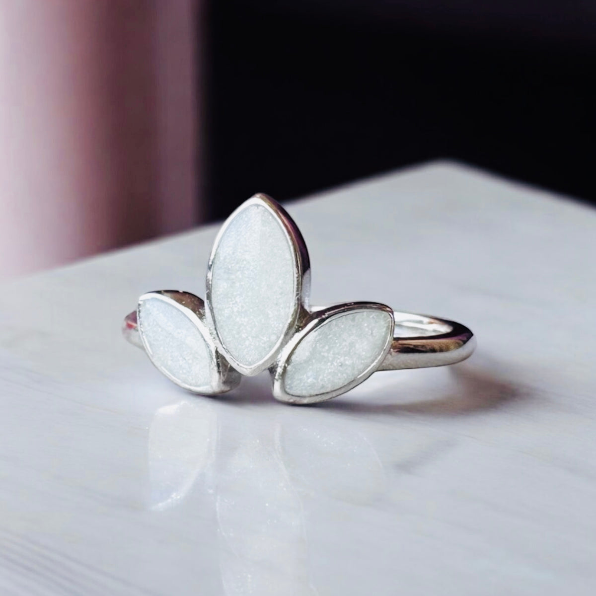 Sterling silver three marquise keepsake ring, featuring three elegant marquise-shaped settings personalised with breastmilk, cremation ashes, umbilical cord, hair or pet fur. Handcrafted in West Wales by Afallon DNA Jewellery.