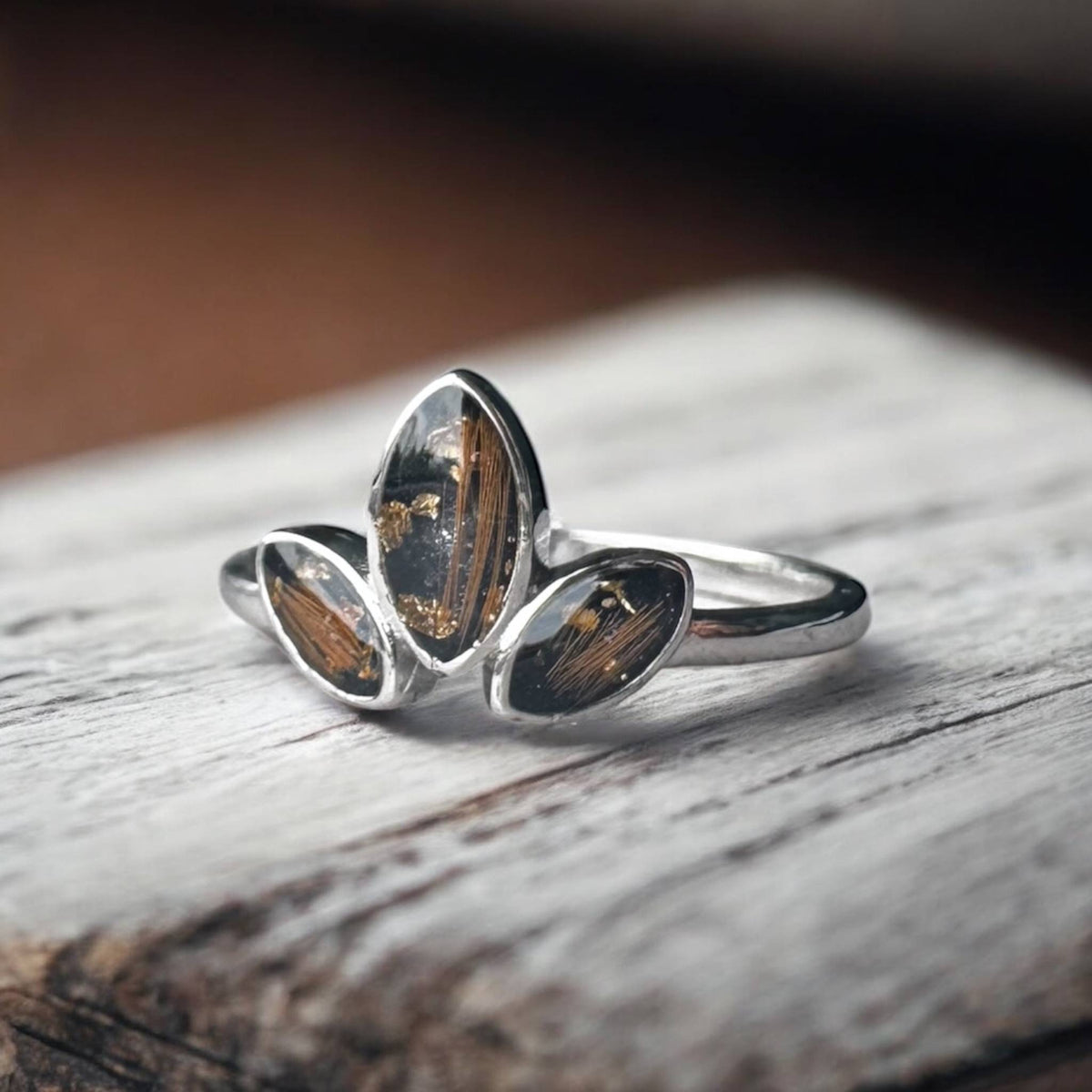 Sterling silver three marquise keepsake ring, featuring three elegant marquise-shaped settings personalised with breastmilk, cremation ashes, umbilical cord, hair or pet fur. Handcrafted in West Wales by Afallon DNA Jewellery.