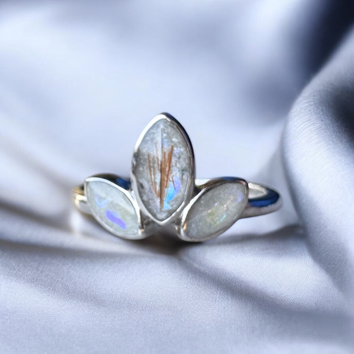 Sterling silver three marquise keepsake ring, featuring three elegant marquise-shaped settings personalised with breastmilk, cremation ashes, umbilical cord, hair or pet fur. Handcrafted in West Wales by Afallon DNA Jewellery.